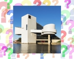 A photo of the Rock And Roll Hall Of Fame on some question marks.
