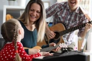Ear Training For The Guitar - A photo of a family enjoying music.