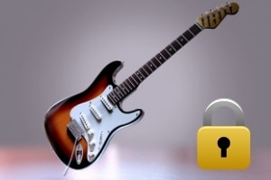 Best guitar strap lock system - A guitar with a pad lock.