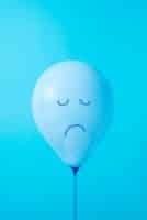 A balloon with a sad face