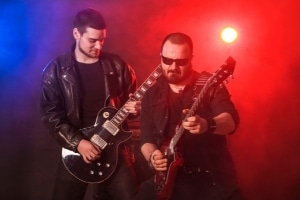 Learning Guitar Solos - Two guitar players playing a double-solo