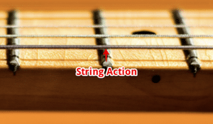 Fingertips Hurt Playing Guitar - A guitar neck with an arrow, illustrating the string height.