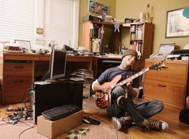Marshall DSL1C Review – A young boy jamming out on an electric guitar in his bedroom