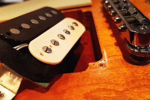 Humbucker Pickups Vs Single Coil - A split double coil pickup being installed in an electric guitar
