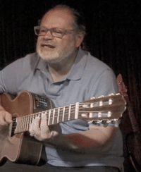Dedicated To You By Jorge Garcia – Jorge playing a nylon string guitar.