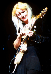 Female Rock Guitar Players - Jennifer Batten, playing her guitar onstage.