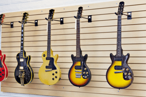 How To Store A Guitar – Guitars hanging on the wall