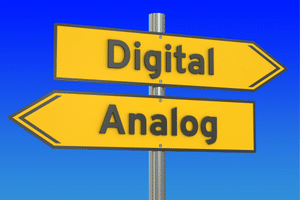 Wireless Guitar System - An image of a post with two signs pointing in opposite directions. One says analog, and the other says digital.