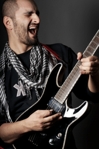 Super Strat Guitars - A photo of someone shredding guitar.
