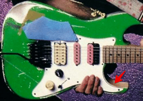 Super Strat Guitars - Steve Vai's "Green Meanie" guitar with modified lower horn (see red arrow).