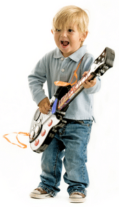 Tele Vs Strat Sound - A small boy playing an electric guitar.
