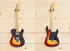 Tele Vs Strat Sound - A Telecaster and a Stratocaster guitar hanging on the wall.