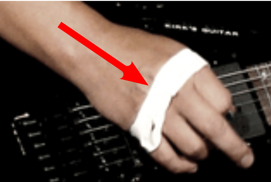 Why Guitarists Tape Their Hand - The right hand is taped over the knuckles