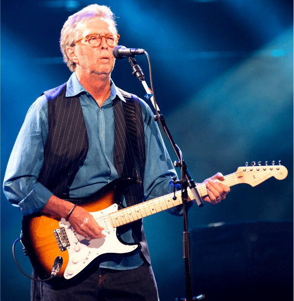 What Makes A Guitarist Unique - Eric Clapton playing guitar on stage